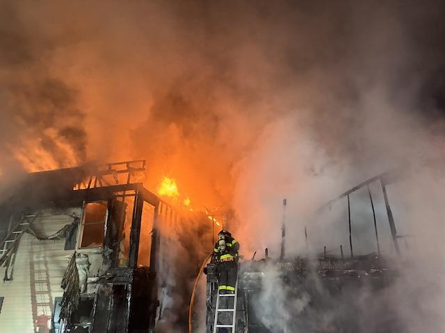 Building a total loss as KFD crews work hot spots